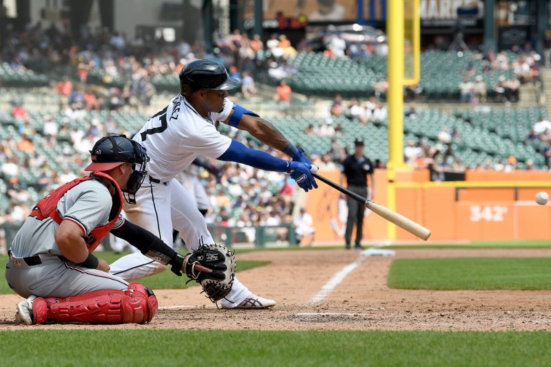 Jun 13, 2024; Detroit, Michigan, USA;  Detroit Tigers second baseman Andy Ibáñez (77) hits an RBI double against the Washington Nationals in the seventh inning at Comerica Park. Mandatory Credit: Lon Horwedel-USA TODAY Sports
