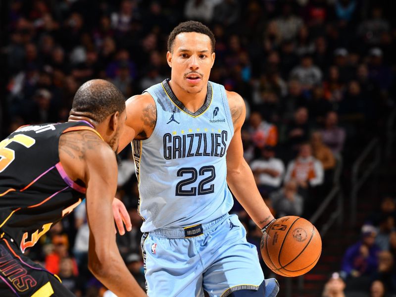 PHOENIX, AZ - FEBRUARY 11:  Desmond Bane #22 of the Memphis Grizzlies dribbles the ball during the game against the Phoenix Suns on February 11, 2025 at Footprint Center in Phoenix, Arizona. NOTE TO USER: User expressly acknowledges and agrees that, by downloading and or using this photograph, user is consenting to the terms and conditions of the Getty Images License Agreement. Mandatory Copyright Notice: Copyright 2025 NBAE (Photo by Barry Gossage/NBAE via Getty Images)