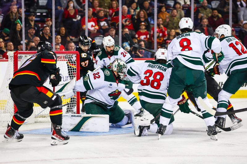 Dec 4, 2025; Calgary, Alberta, CAN; Calgary Flames left wing Jonathan Huberdeau (10) scores a goal against Minnesota Wild goaltender Filip Gustavsson (32) during the second period at Scotiabank Saddledome. Mandatory Credit: Sergei Belski-Imagn Images