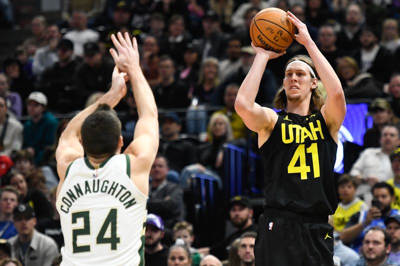 SALT LAKE CITY, UTAH - FEBRUARY 04: Kelly Olynyk #41 of the Utah Jazz shoots over Pat Connaughton #24 of the Milwaukee Bucks during the second half at Delta Center on February 04, 2024 in Salt Lake City, Utah. NOTE TO USER: User expressly acknowledges and agrees that, by downloading and or using this photograph, User is consenting to the terms and conditions of the Getty Images License Agreement. (Photo by Alex Goodlett/Getty Images)