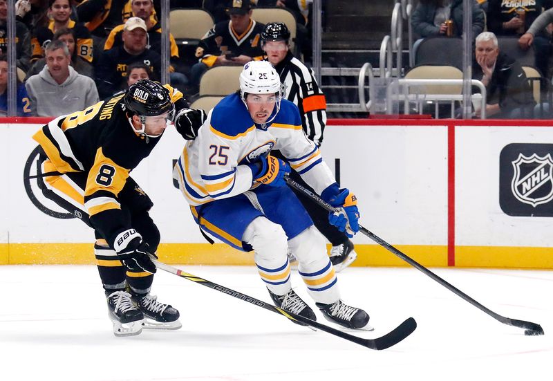 Oct 16, 2024; Pittsburgh, Pennsylvania, USA; Buffalo Sabres defenseman Owen Power (25) moves the puck ahead of Pittsburgh Penguins left wing Michael Bunting (8) during the third period at PPG Paints Arena. Mandatory Credit: Charles LeClaire-Imagn Images