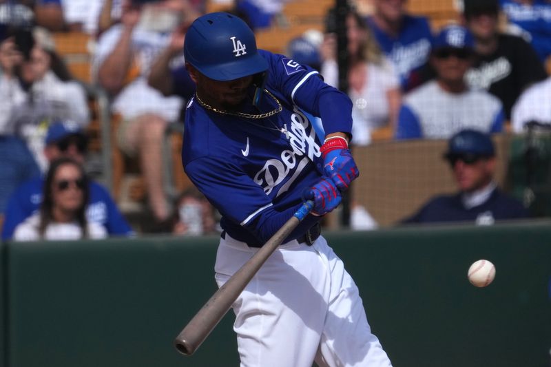 Feb 27, 2024; Phoenix, Arizona, USA; Los Angeles Dodgers infielder Mookie Bettes (50) bats against the Chicago White Sox during the fifth inning at Camelback Ranch-Glendale. Mandatory Credit: Joe Camporeale-USA TODAY Sports