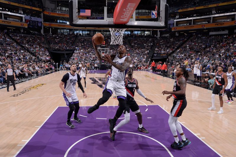 SACRAMENTO, CA - OCTOBER 13: DeMar DeRozan #10 of the Sacramento Kings drives to the basket during the game against the Portland Trail Blazers during a NBA preseason game on October 13, 2024 at Golden 1 Center in Sacramento, California. NOTE TO USER: User expressly acknowledges and agrees that, by downloading and or using this Photograph, user is consenting to the terms and conditions of the Getty Images License Agreement. Mandatory Copyright Notice: Copyright 2024 NBAE (Photo by Rocky Widner/NBAE via Getty Images)