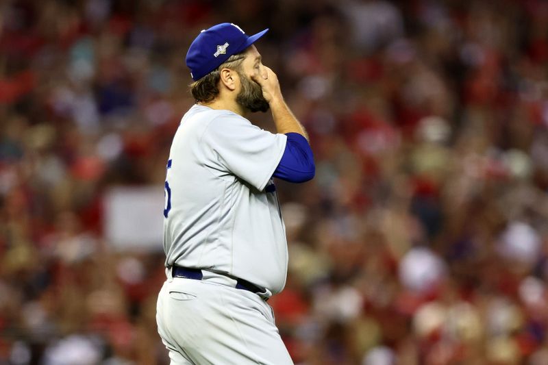 Oct 11, 2023; Phoenix, Arizona, USA; Los Angeles Dodgers starting pitcher Lance Lynn (35) reacts after giving a up three home runs to the Arizona Diamondbacks in the third inning for game three of the NLDS for the 2023 MLB playoffs at Chase Field. Mandatory Credit: Mark J. Rebilas-USA TODAY Sports