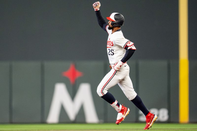 Apr 23, 2025; Minneapolis, Minnesota, USA; Minnesota Twins center fielder Byron Buxton (25) hits a two-run home run off Chicago White Sox pitcher Cam Booser (71) in the seventh inning at Target Field. Mandatory Credit: Matt Blewett-Imagn Images