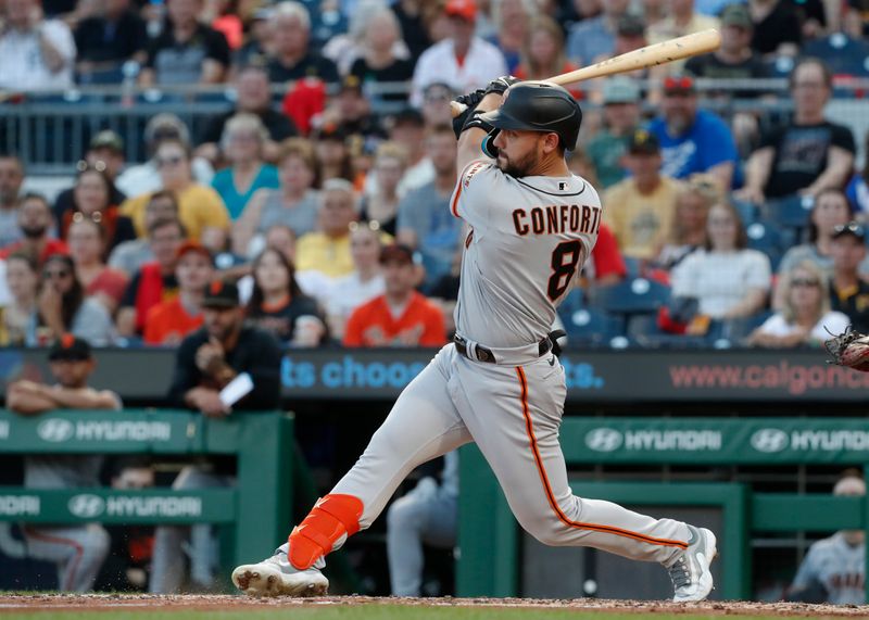 Jul 14, 2023; Pittsburgh, Pennsylvania, USA; San Francisco Giants right fielder Michael Conforto (8) hits a two run single against the Pittsburgh Pirates during the fifth inning  at PNC Park. Mandatory Credit: Charles LeClaire-USA TODAY Sports