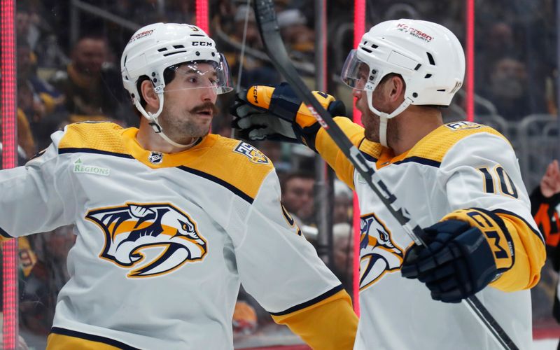 Apr 15, 2024; Pittsburgh, Pennsylvania, USA;  Nashville Predators left wing Filip Forsberg (right) celebrates his goal with center Colton Sissons (10) against the Pittsburgh Penguins during the second period at PPG Paints Arena. Mandatory Credit: Charles LeClaire-USA TODAY Sports