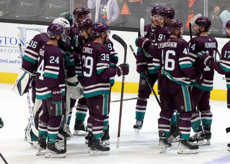 Nov 12, 2023; Anaheim, California, USA; Anaheim Ducks players celebrate after defeating the San Jose Sharks at Honda Center. Mandatory Credit: Jason Parkhurst-USA TODAY Sports