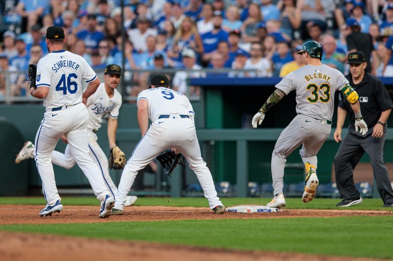 May 18, 2024; Kansas City, Missouri, USA; Oakland Athletics outfielder JJ Bleday (33) tags first base for a single as the Kansas City Royals bobble the ball at first base during the seventh inning at Kauffman Stadium. Mandatory Credit: William Purnell-USA TODAY Sports