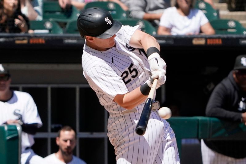 Jun 30, 2024; Chicago, Illinois, USA; Chicago White Sox first baseman Andrew Vaughn (25) hits a single against the Colorado Rockies during the sixth inning at Guaranteed Rate Field. Mandatory Credit: David Banks-USA TODAY Sports