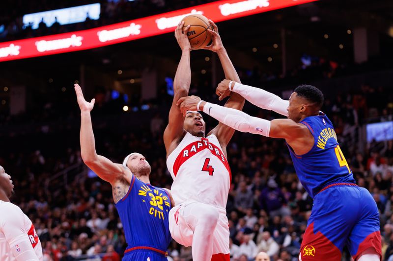 TORONTO, CANADA - OCTOBER 28: Russell Westbrook #4 of the Denver Nuggets fouls Scottie Barnes #4 of the Toronto Raptors as he drives to the basket during the second half of their NBA game at Scotiabank Arena on October 28, 2024 in Toronto, Ontario, Canada. NOTE TO USER: User expressly acknowledges and agrees that, by downloading and or using this photograph, User is consenting to the terms and conditions of the Getty Images License Agreement. (Photo by Cole Burston/Getty Images)