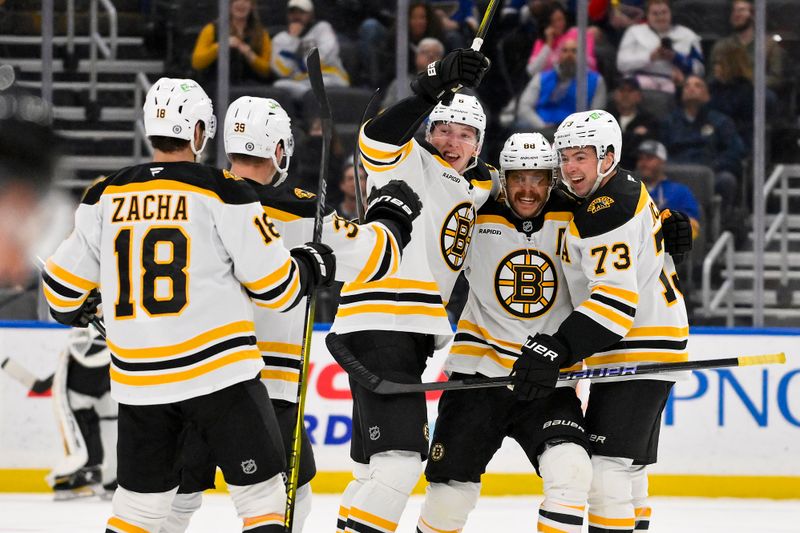 Nov 12, 2024; St. Louis, Missouri, USA;  Boston Bruins right wing David Pastrnak (88) celebrates with teammates after scoring the game winning goal against the St. Louis Blues during the third period at Enterprise Center. Mandatory Credit: Jeff Curry-Imagn Images