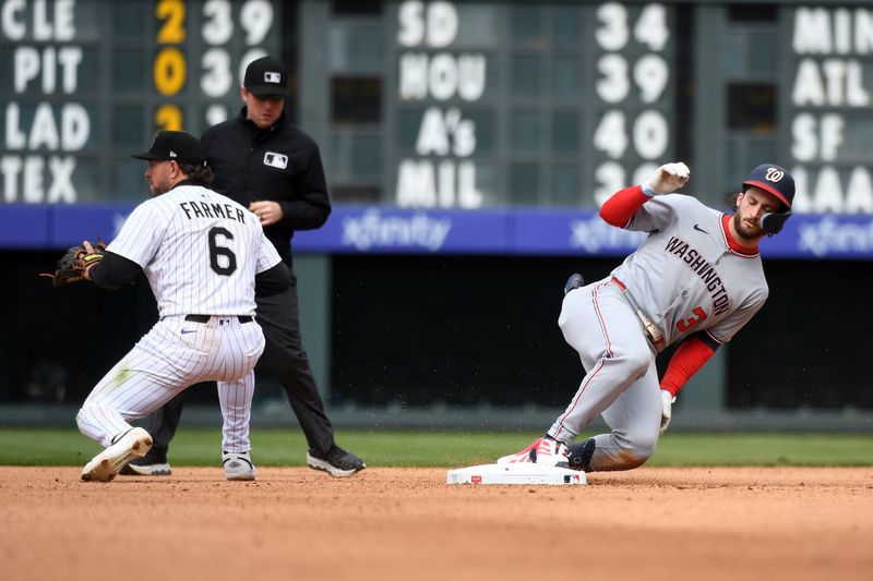 Apr 19, 2025; Denver, Colorado, USA; Washington Nationals outfielder Dylan Crews (3) slides into second ahead of a play by Colorado Rockies second base Kyle Farmer (6) during the seventh inning at Coors Field. Mandatory Credit: Christopher Hanewinckel-Imagn Images