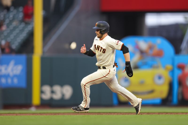 Jul 5, 2023; San Francisco, California, USA; San Francisco Giants center fielder Austin Slater (13) scores a run during the fifth inning on an error by Seattle Mariners center fielder Julio Rodriguez (not pictured) during the fifth inning at Oracle Park. Mandatory Credit: Sergio Estrada-USA TODAY Sports