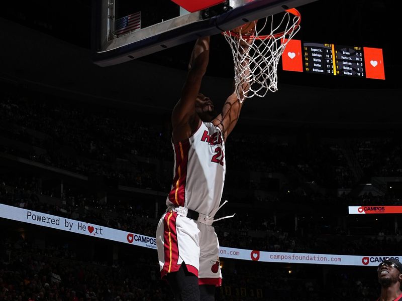 DENVER, CO - FEBRUARY 29: Jimmy Butler #22 of the Miami Heat dunks the ball during the game against the Denver Nuggets on February 29, 2024 at the Ball Arena in Denver, Colorado. NOTE TO USER: User expressly acknowledges and agrees that, by downloading and/or using this Photograph, user is consenting to the terms and conditions of the Getty Images License Agreement. Mandatory Copyright Notice: Copyright 2024 NBAE (Photo by Garrett Ellwood/NBAE via Getty Images)