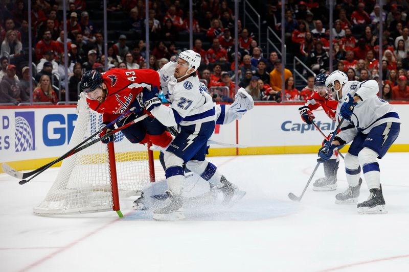 Oct 14, 2025; Washington, District of Columbia, USA; Washington Capitals right wing Tom Wilson (43) crashes into the net after colliding with Tampa Bay Lightning goaltender Andrei Vasilevskiy (88) and Lightning defenseman Ryan McDonagh (27) while attempting a shot on goal in the third period at Capital One Arena. Mandatory Credit: Geoff Burke-Imagn Images