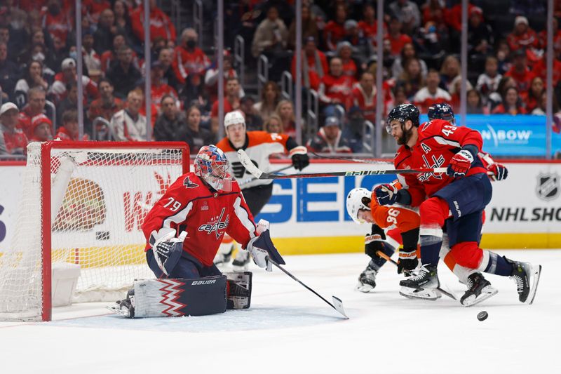 Mar 1, 2024; Washington, District of Columbia, USA; Washington Capitals right wing Tom Wilson (43) checks Philadelphia Flyers left wing Joel Farabee (86) off the puck in front of Capitals goaltender Charlie Lindgren (79) in the second period at Capital One Arena. Mandatory Credit: Geoff Burke-USA TODAY Sports