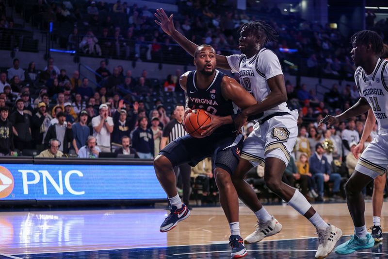 Jan 20, 2024; Atlanta, Georgia, USA; Virginia Cavaliers forward Jordan Minor (22) is defended by Georgia Tech Yellow Jackets forward Ebenezer Dowuona (10) in the first half at McCamish Pavilion. Mandatory Credit: Brett Davis-USA TODAY Sports