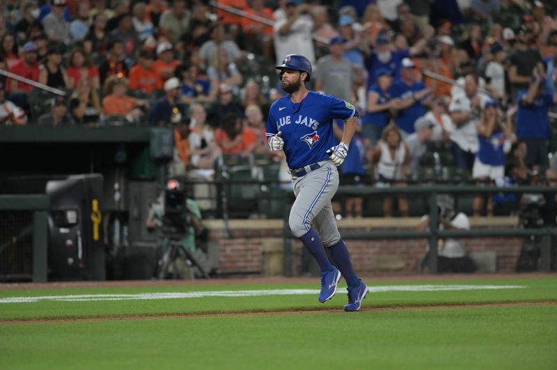 Aug 22, 2023; Baltimore, Maryland, USA; Toronto Blue Jays designated hitter Brandon Belt (13) runs home after hitting a two run home run in the tenth inning against the Baltimore Orioles  at Oriole Park at Camden Yards. Mandatory Credit: Tommy Gilligan-USA TODAY Sports