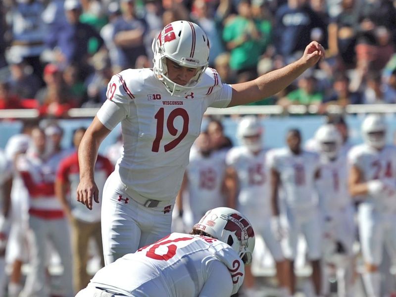 Sep 25, 2021; Chicago, Illinois, USA; Wisconsin Badgers kicker Collin Larsh (19) kicks a field goal during the first half against the Notre Dame Fighting Irish at Soldier Field. Mandatory Credit: Patrick Gorski-USA TODAY Sports