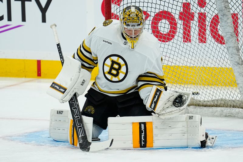 Apr 24, 2024; Toronto, Ontario, CAN; Boston Bruins goaltender Jeremy Swayman (1) makes a save during warm-up of game three of the first round of the 2024 Stanley Cup Playoffs against the Toronto Maple Leafs at Scotiabank Arena. Mandatory Credit: John E. Sokolowski-USA TODAY Sports