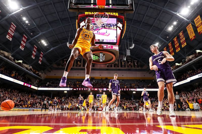 Feb 3, 2024; Minneapolis, Minnesota, USA; Minnesota Golden Gophers forward Pharrel Payne (21) celebrates his dunk against the Northwestern Wildcats during overtime at Williams Arena. Mandatory Credit: Matt Krohn-USA TODAY Sports