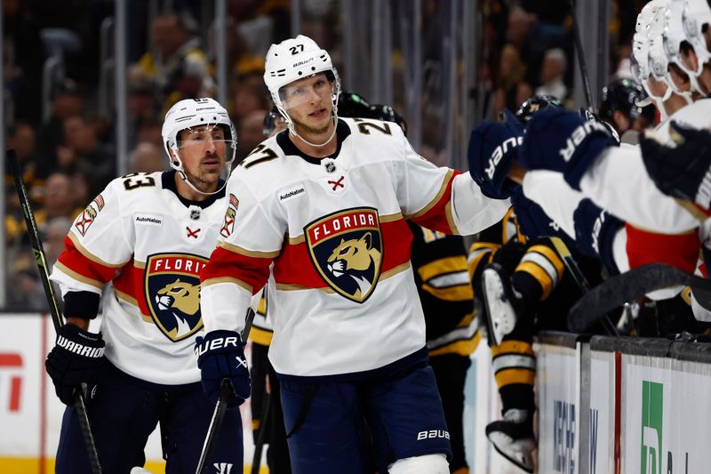 Oct 21, 2025; Boston, Massachusetts, USA; Florida Panthers center Eetu Luostarinen (27) is congratulated at the bench with left wing Brad Marchand (63) after Luostarinen’s goal against the Boston Bruins during the third period at TD Garden. Mandatory Credit: Winslow Townson-Imagn Images