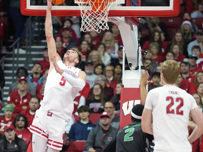 Dec 22, 2023; Madison, Wisconsin, USA; Wisconsin Badgers forward Tyler Wahl (5) scores against the Chicago State Cougars during the first half at the Kohl Center. Mandatory Credit: Kayla Wolf-USA TODAY Sports