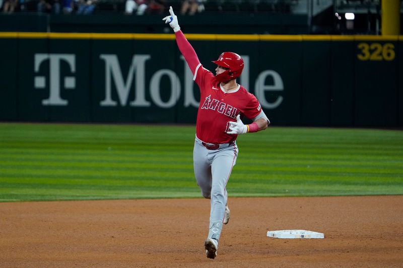 Sep 6, 2024; Arlington, Texas, USA; Los Angeles Angels catcher Logan O'Hoppe (14) reacts as he rounds the bases after hitting a three-run home run during the sixth inning against the Texas Rangers at Globe Life Field. Mandatory Credit: Raymond Carlin III-Imagn Images