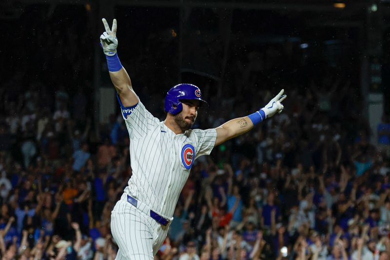 Aug 1, 2024; Chicago, Illinois, USA; Chicago Cubs outfielder Mike Tauchman (40) celebrates his walk-off single against the St. Louis Cardinals during the ninth inning at Wrigley Field. Mandatory Credit: Kamil Krzaczynski-USA TODAY Sports