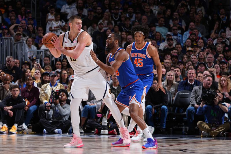 DENVER, CO - MARCH 21: Nikola Jokic #15 of the Denver Nuggets handles the ball during the game against the New York Knicks on March 21, 2024 at the Ball Arena in Denver, Colorado. NOTE TO USER: User expressly acknowledges and agrees that, by downloading and/or using this Photograph, user is consenting to the terms and conditions of the Getty Images License Agreement. Mandatory Copyright Notice: Copyright 2024 NBAE (Photo by Garrett Ellwood/NBAE via Getty Images)