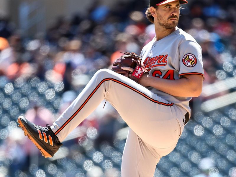 May 8, 2025; Minneapolis, Minnesota, USA; Baltimore Orioles starting pitcher Dean Kremer (64) delivers a pitch against the Minnesota Twins during the first inning at Target Field. Mandatory Credit: Matt Krohn-Imagn Images