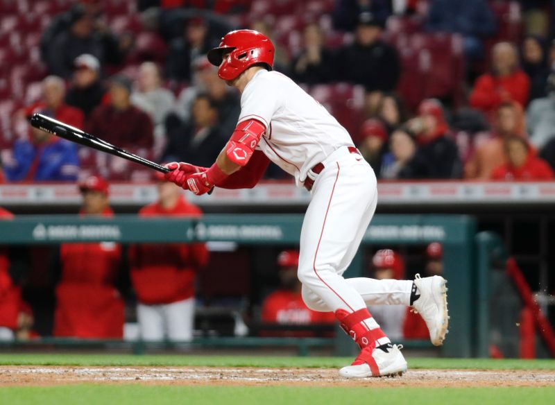 Apr 17, 2023; Cincinnati, Ohio, USA; Cincinnati Reds designated hitter Kevin Newman (28) hits a RBI single against the Tampa Bay Rays during the seventh inning at Great American Ball Park. Mandatory Credit: David Kohl-USA TODAY Sports