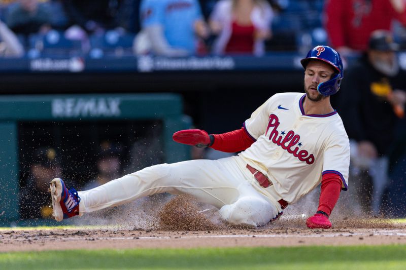 Apr 13, 2024; Philadelphia, Pennsylvania, USA; Philadelphia Phillies shortstop Trea Turner (7) scores against the Pittsburgh Pirates during the first inning at Citizens Bank Park. Mandatory Credit: Bill Streicher-USA TODAY Sports