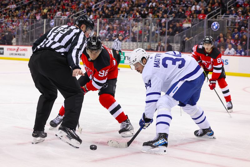 Mar 7, 2023; Newark, New Jersey, USA; New Jersey Devils right wing Timo Meier (96) and Toronto Maple Leafs center Auston Matthews (34) face-off during the second period at Prudential Center. Mandatory Credit: Ed Mulholland-USA TODAY Sports