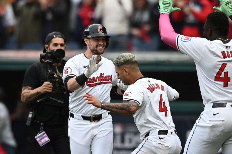 Oct 12, 2024; Cleveland, Ohio, USA; Cleveland Guardians outfielder Lane Thomas (8) celebrates with shortstop Brayan Rocchio (4) in the fifth inning against the Detroit Tigers during game five of the ALDS for the 2024 MLB Playoffs at Progressive Field. Mandatory Credit: Ken Blaze-Imagn Images
