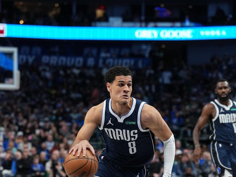 DALLAS, TX - FEBRUARY 12: Josh Green #8 of the Dallas Mavericks handles the ball during the game against the Washington Wizards on February 12, 2024 at the American Airlines Center in Dallas, Texas. NOTE TO USER: User expressly acknowledges and agrees that, by downloading and or using this photograph, User is consenting to the terms and conditions of the Getty Images License Agreement. Mandatory Copyright Notice: Copyright 2024 NBAE (Photo by Glenn James/NBAE via Getty Images)