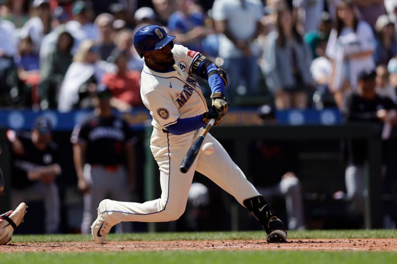 Jun 1, 2025; Seattle, Washington, USA; Seattle Mariners Left fielder Randy Arozarena (56) hits a walkoff single against the Minnesota Twins during the ninth inning at T-Mobile Park. Mandatory Credit: John Froschauer-Imagn Images