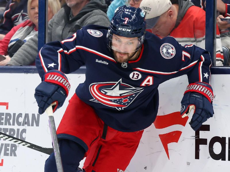 Jan 25, 2025; Columbus, Ohio, USA;  Columbus Blue Jackets center Sean Kuraly (7) skates for the puck during the second period against the Los Angeles Kings at Nationwide Arena. Mandatory Credit: Joseph Maiorana-Imagn Images