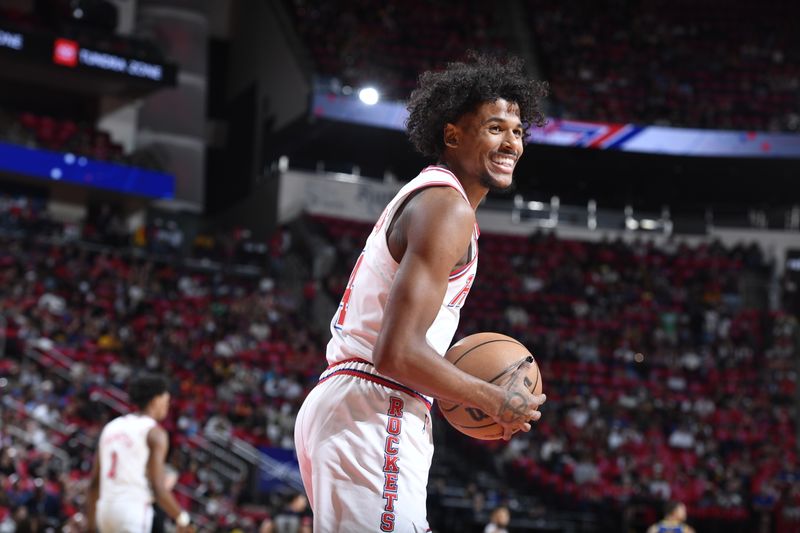 HOUSTON, TX - APRIL 4: Jalen Green #4 of the Houston Rockets smiles during the game against the Golden State Warriors on April 4, 2024 at the Toyota Center in Houston, Texas. NOTE TO USER: User expressly acknowledges and agrees that, by downloading and or using this photograph, User is consenting to the terms and conditions of the Getty Images License Agreement. Mandatory Copyright Notice: Copyright 2024 NBAE (Photo by Logan Riely/NBAE via Getty Images)