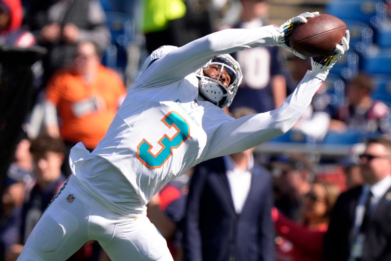 Miami Dolphins wide receiver Odell Beckham Jr. (3) catches a pass prior to an NFL football game against the New England Patriots, Sunday, Oct. 6, 2024, in Foxborough, Mass. (AP Photo/Steven Senne)