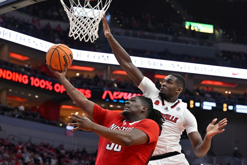 Jan 13, 2024; Louisville, Kentucky, USA;  North Carolina State Wolfpack forward DJ Burns Jr. (30) shoots the ball against Louisville Cardinals forward Brandon Huntley-Hatfield (5) during the first half at KFC Yum! Center. Mandatory Credit: Jamie Rhodes-USA TODAY Sports