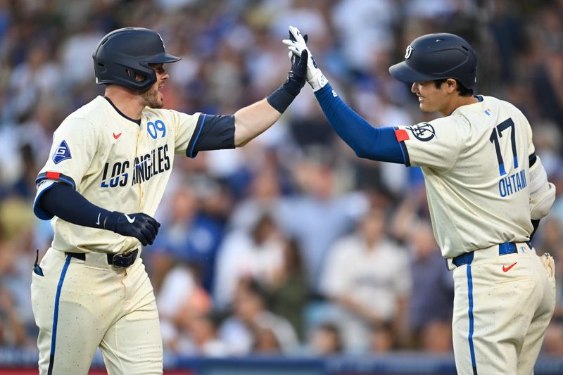 Jun 22, 2024; Los Angeles, California, USA; Los Angeles Dodgers second baseman Gavin Lux (9) celebrates with designated hitter Shohei Ohtani (17) after hitting a home run against the Los Angeles Angels during the third inning at Dodger Stadium. Mandatory Credit: Jonathan Hui-USA TODAY Sports