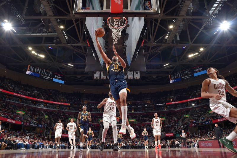 CLEVELAND, OH - APRIL 13: Tony Bradley #13 of the Indiana Pacers drives to the basket during the game against the Cleveland Cavaliers  on April 13, 2025 at Rocket Arena in Cleveland, Ohio. NOTE TO USER: User expressly acknowledges and agrees that, by downloading and/or using this Photograph, user is consenting to the terms and conditions of the Getty Images License Agreement. Mandatory Copyright Notice: Copyright 2025 NBAE (Photo by David Liam Kyle/NBAE via Getty Images)