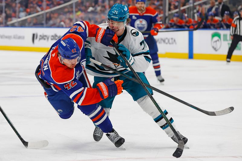 Jan 29, 2026; Edmonton, Alberta, CAN; San Jose Sharks forward Macklin Celebrini (71) trips up Edmonton Oilers forward Kasperi Kapanen (42) during the third period at Rogers Place. Mandatory Credit: Perry Nelson-Imagn Images