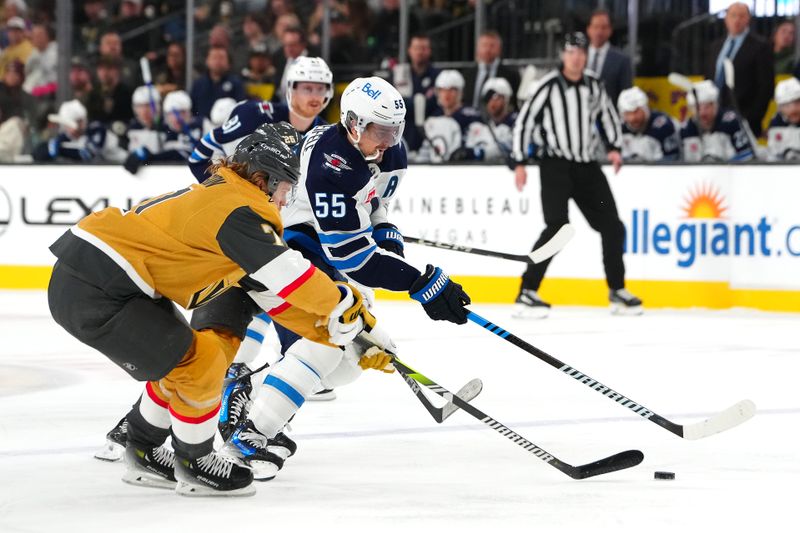 Nov 29, 2024; Las Vegas, Nevada, USA; Winnipeg Jets center Mark Scheifele (55) skates against Vegas Golden Knights center William Karlsson (71) during the third period at T-Mobile Arena. Mandatory Credit: Stephen R. Sylvanie-Imagn Images