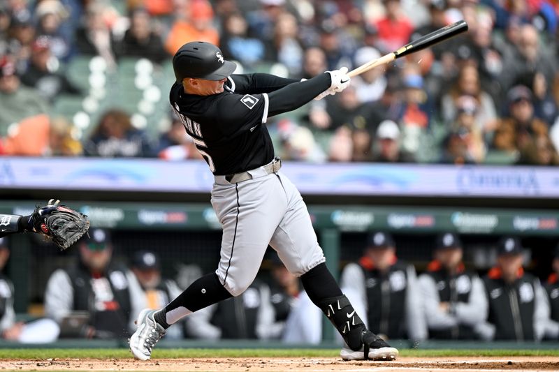Apr 6, 2025; Detroit, Michigan, USA;  Chicago White Sox first baseman Andrew Vaughn (25) hits an RBI single against the Detroit Tigers in the first inning at Comerica Park. Mandatory Credit: Lon Horwedel-Imagn Images