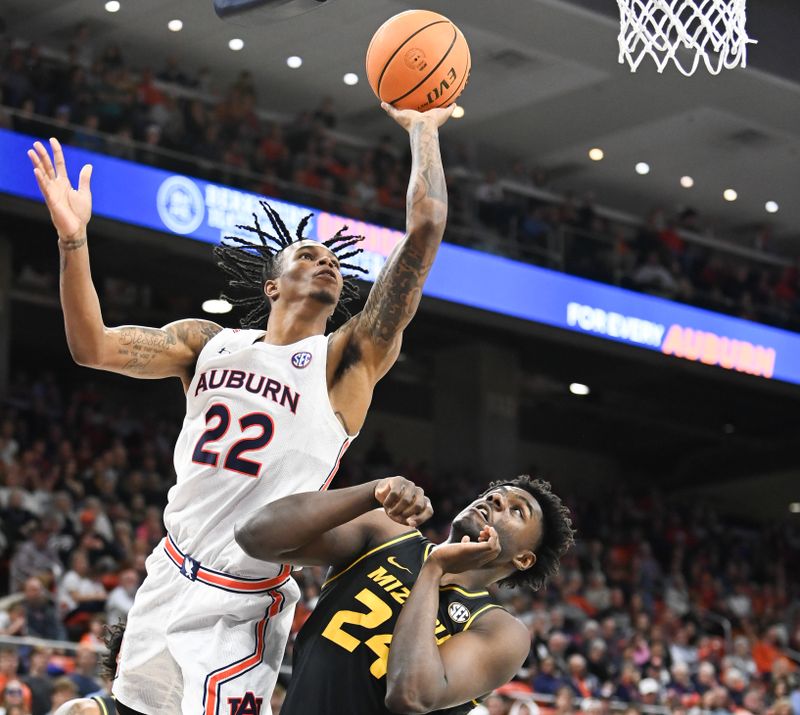 Feb 14, 2023; Auburn, Alabama, USA;  Auburn Tigers guard Allen Flanigan (22) shoots over Missouri Tigers guard Kobe Brown (24) during the second half at Neville Arena. Mandatory Credit: Julie Bennett-USA TODAY Sports