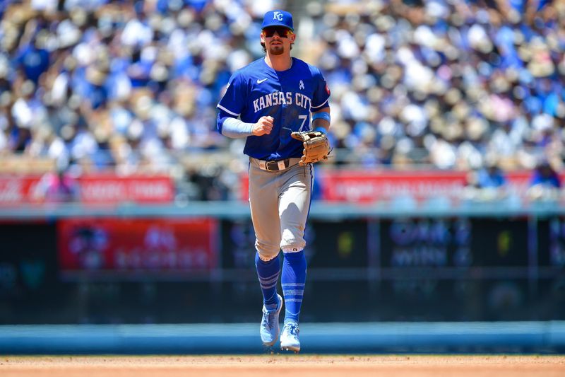 Jun 16, 2024; Los Angeles, California, USA; Kansas City Royals shortstop Bobby Witt Jr. (7) returns to the dugout following the fourth inning against the Los Angeles Dodgers at Dodger Stadium. Mandatory Credit: Gary A. Vasquez-USA TODAY Sports