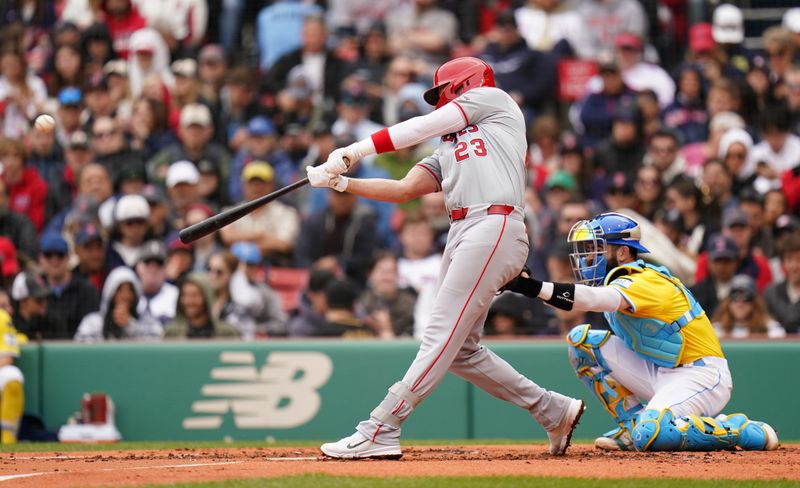 Apr 14, 2024; Boston, Massachusetts, USA; Los Angeles Angels second baseman Brandon Drury (23) hits a home run against the Boston Red Sox in the second inning at Fenway Park. Mandatory Credit: David Butler II-USA TODAY Sports